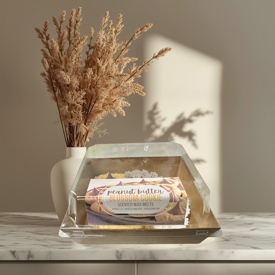 Doodlations Coffee Bar & Boutique Peanut Butter Blossom Cookie scented wax melts in clear packaging.