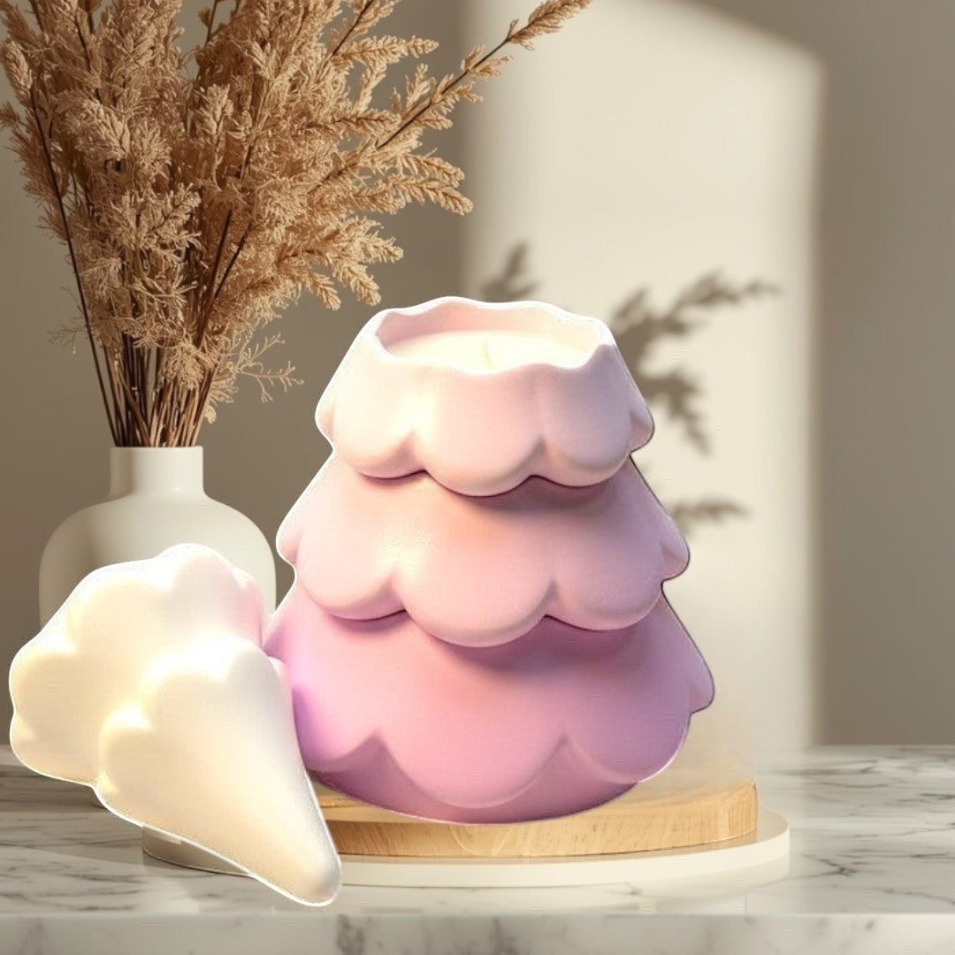 Doodlations Coffee Bar & Boutique 3 tiered pink concrete Christmas tree candle with a white detached top piece.