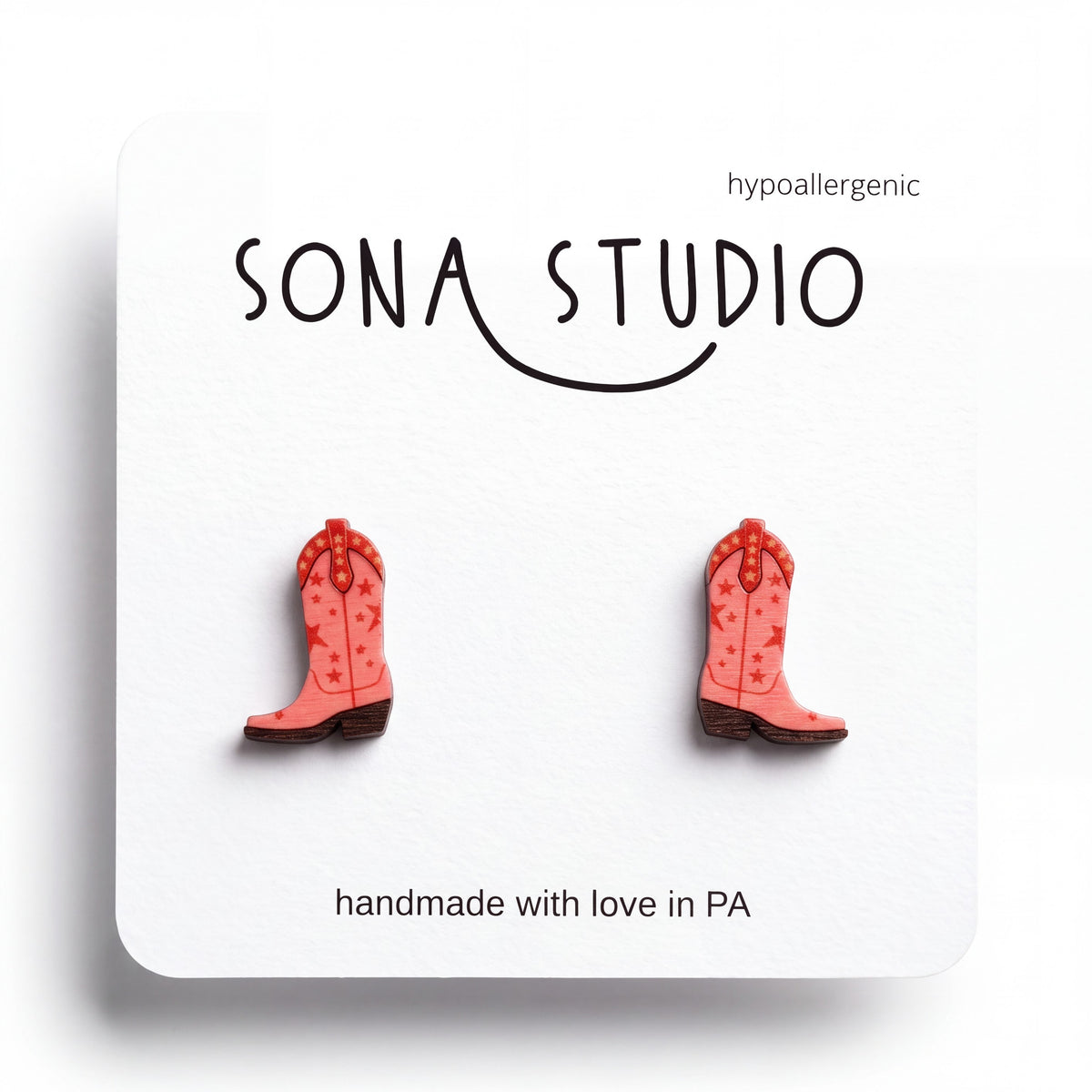 Doodlations Coffee Bar & Boutique pink cowgirl boot stud earrings with star patterns and hypoallergenic posts.