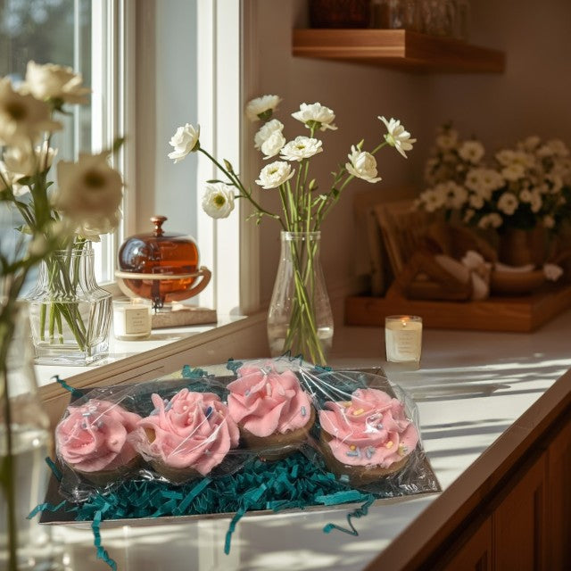 Doodlations Coffee Bar & Boutique Pink Delight Cupcakes wax melts, shaped like cupcakes with pink frosting and sprinkles.