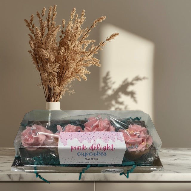 Doodlations Coffee Bar & Boutique Pink Delight Cupcakes wax melts, four pink frosted cupcake-shaped wax melts with sprinkles in a clear box.