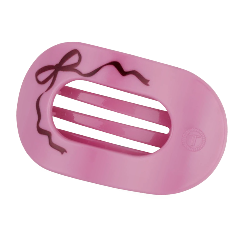 Doodlations Coffee Bar & Boutique pink Teleties flat round hair clip with a brown bow design for comfortable wear.