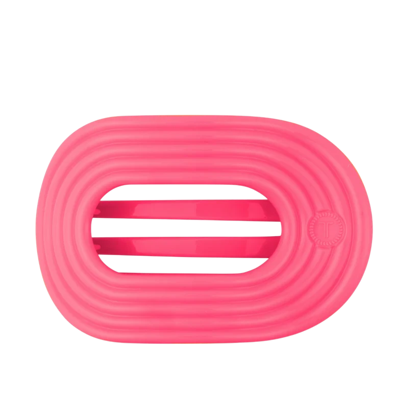 Doodlations Coffee Bar & Boutique Tropic Twist flat pink round hair clip with flexible, durable design.