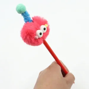 Doodlations Coffee Bar & Boutique pink fuzzy monster gel pen with expressive eyes and a playful antenna topper