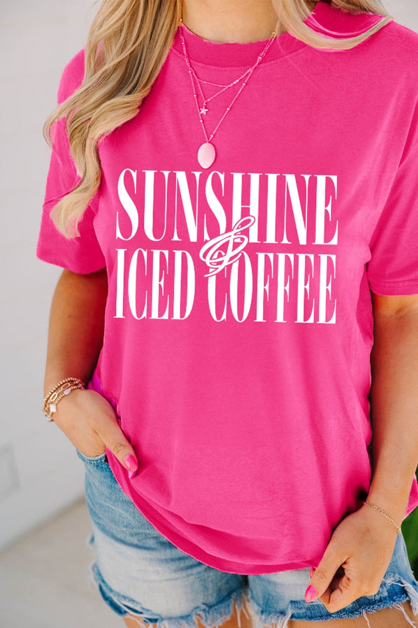 Doodlations Coffee Bar & Boutique hot pink crewneck t-shirt with white Sunshine And Iced Coffee graphic text