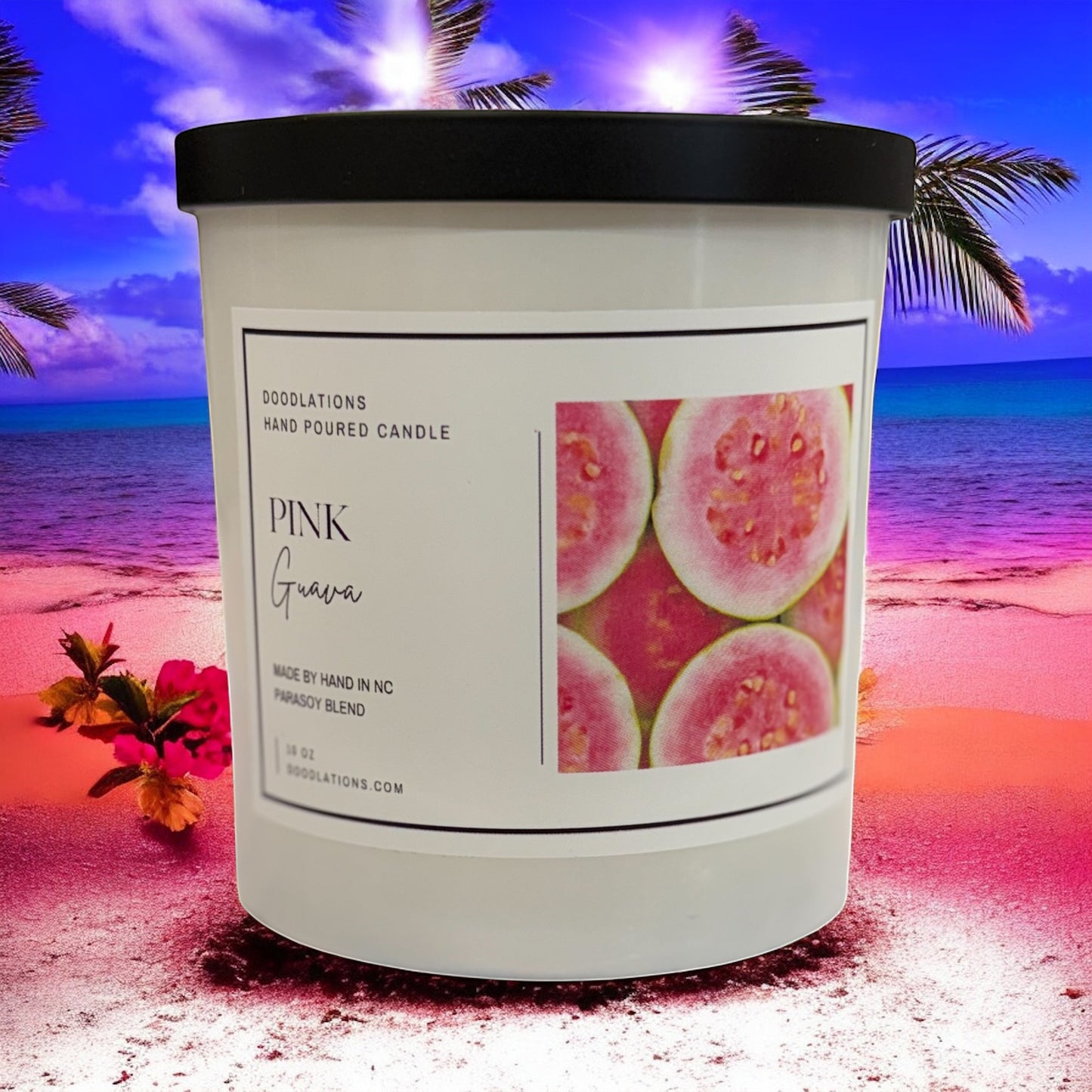 Doodlations Coffee Bar & Boutique Pink Guava hand-poured soy blend candle with a tropical beach background.