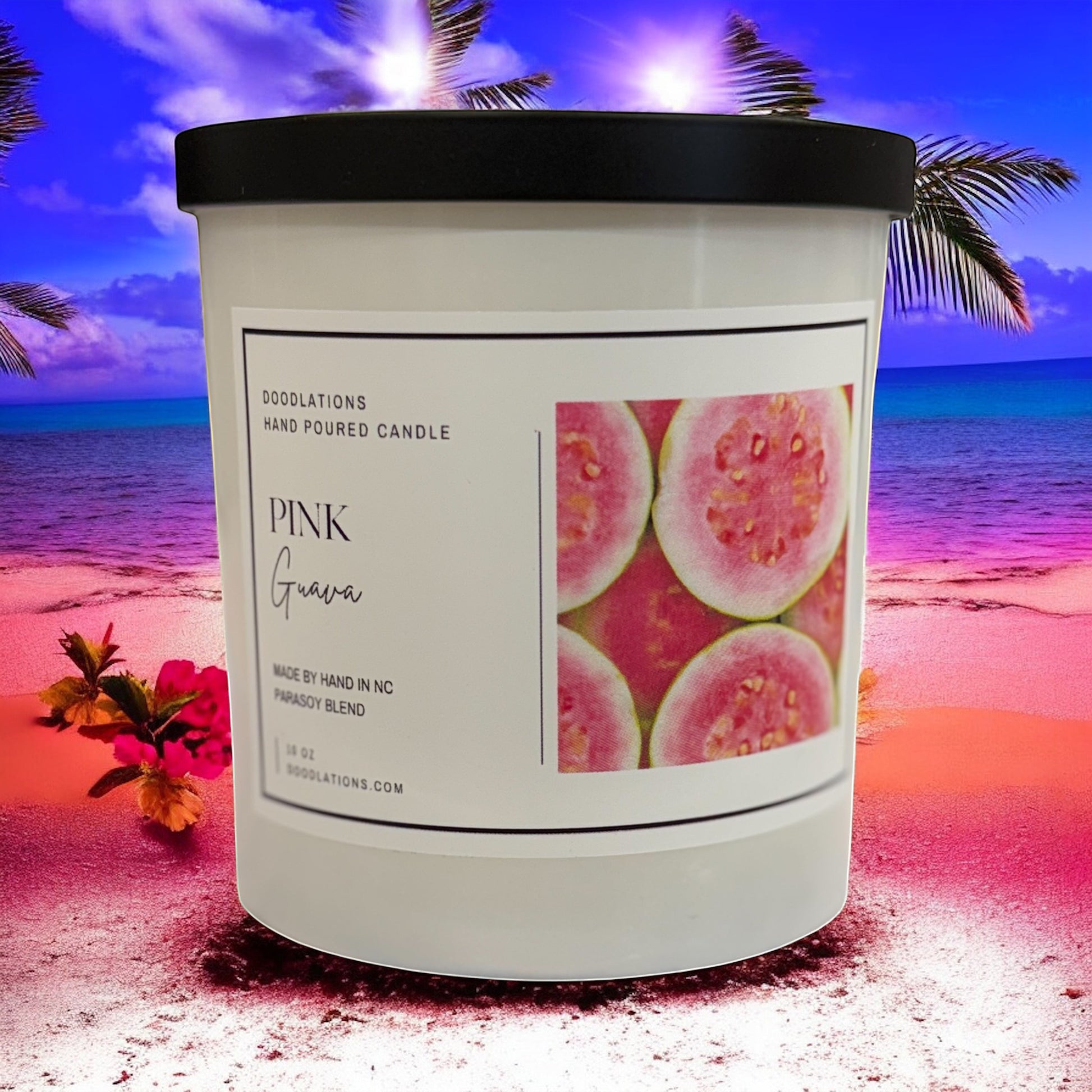 Doodlations Coffee Bar & Boutique Pink Guava hand-poured soy blend candle with a tropical beach background.