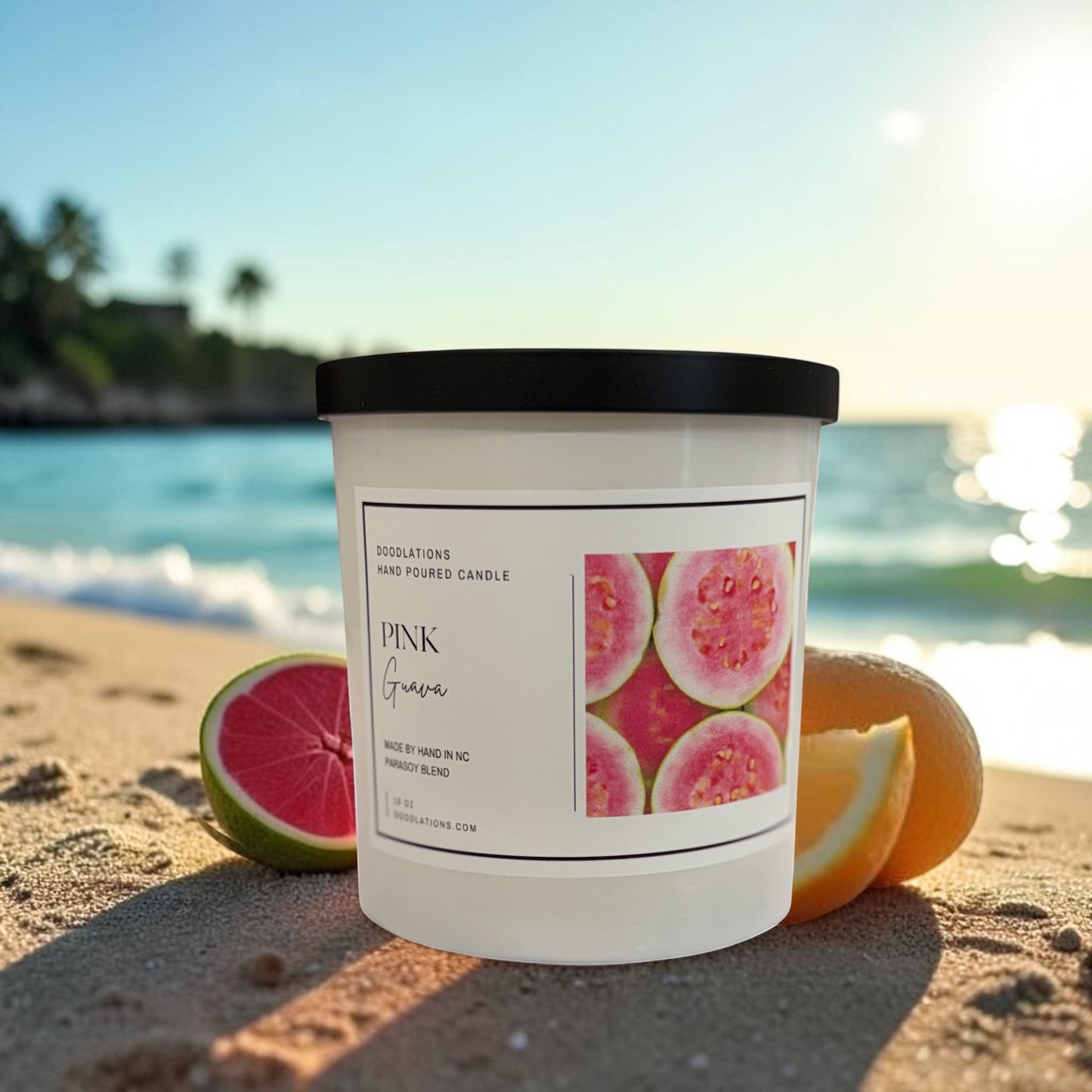 Doodlations Coffee Bar & Boutique Pink Guava hand-poured soy blend candle with a tropical beach background.