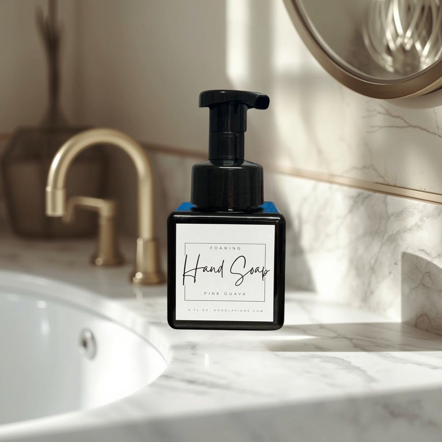 Doodlations Coffee Bar & Boutique Pink Guava foaming hand soap in a black square bottle with a black pump dispenser.