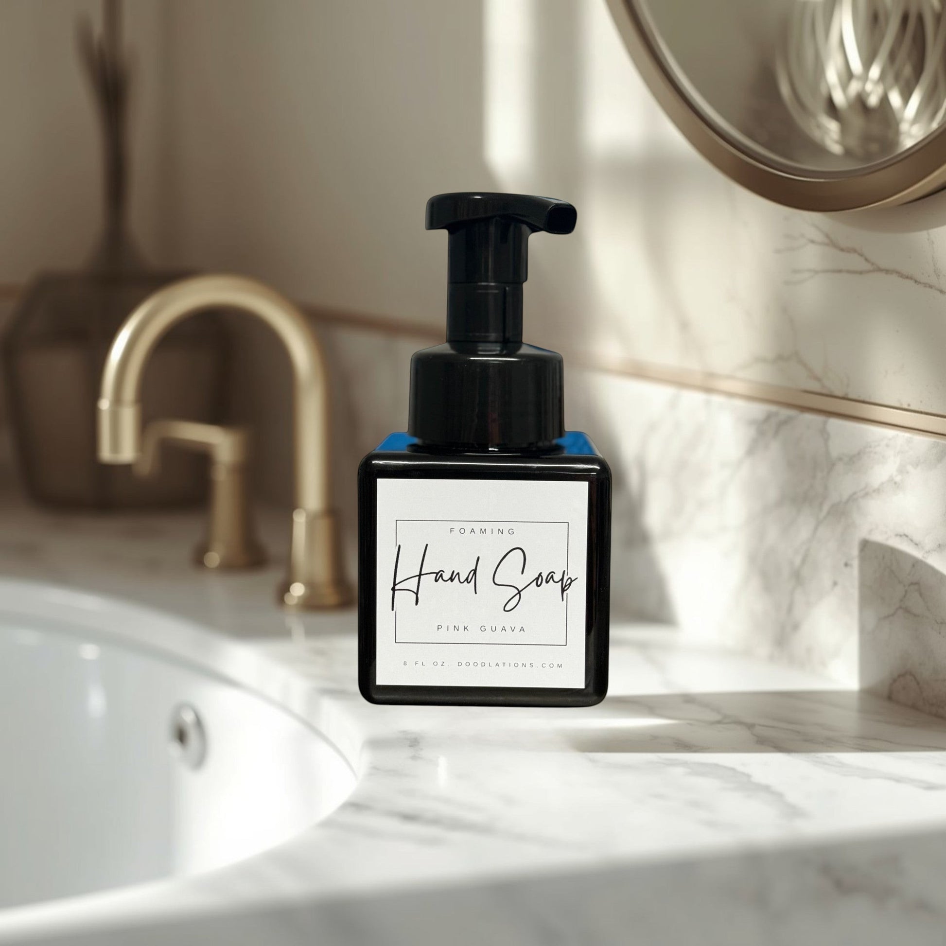 Doodlations Coffee Bar & Boutique Pink Guava foaming hand soap in a black square bottle with a black pump dispenser.