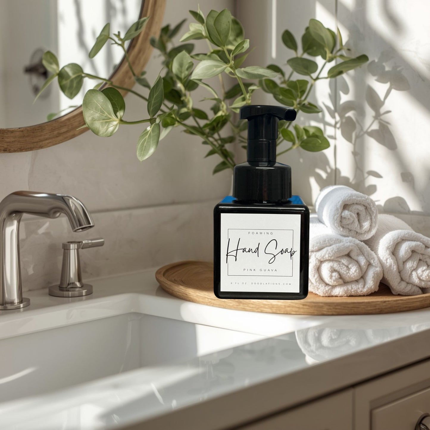 Doodlations Coffee Bar & Boutique Pink Guava Foaming Hand Soap in a black square bottle with a black pump dispenser.