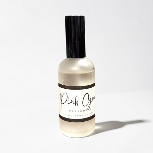Doodlations Coffee Bar & Boutique Pink Guava fine mist perfume in a sleek 5oz glass bottle with a black cap.