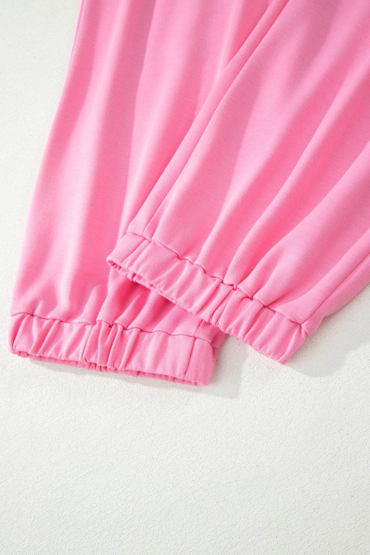 Doodlations Coffee Bar & Boutique pink lounge pants featuring comfortable elasticated gathered cuffs