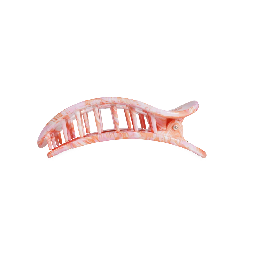 Doodlations Coffee Bar & Boutique Just Keep Swimming flat round hair clip in a pink and white marbled pattern