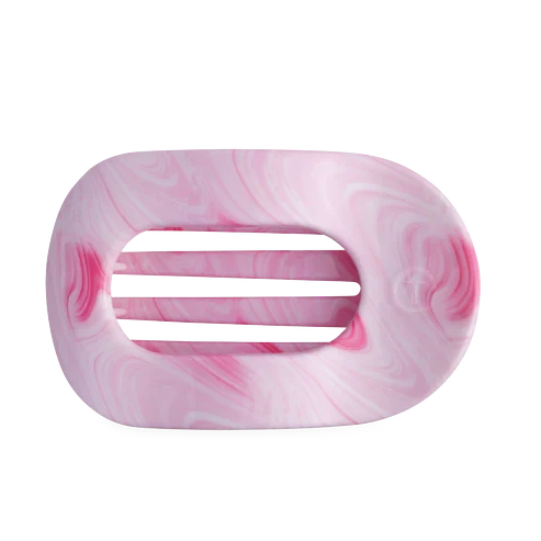Doodlations Coffee Bar & Boutique flat round hair clip in a pink and white marbled pattern with bendable teeth.