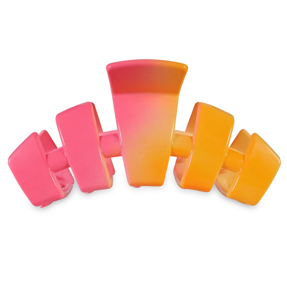 Doodlations Coffee Bar & Boutique pink and orange ombre segmented claw hair clip for secure styling.