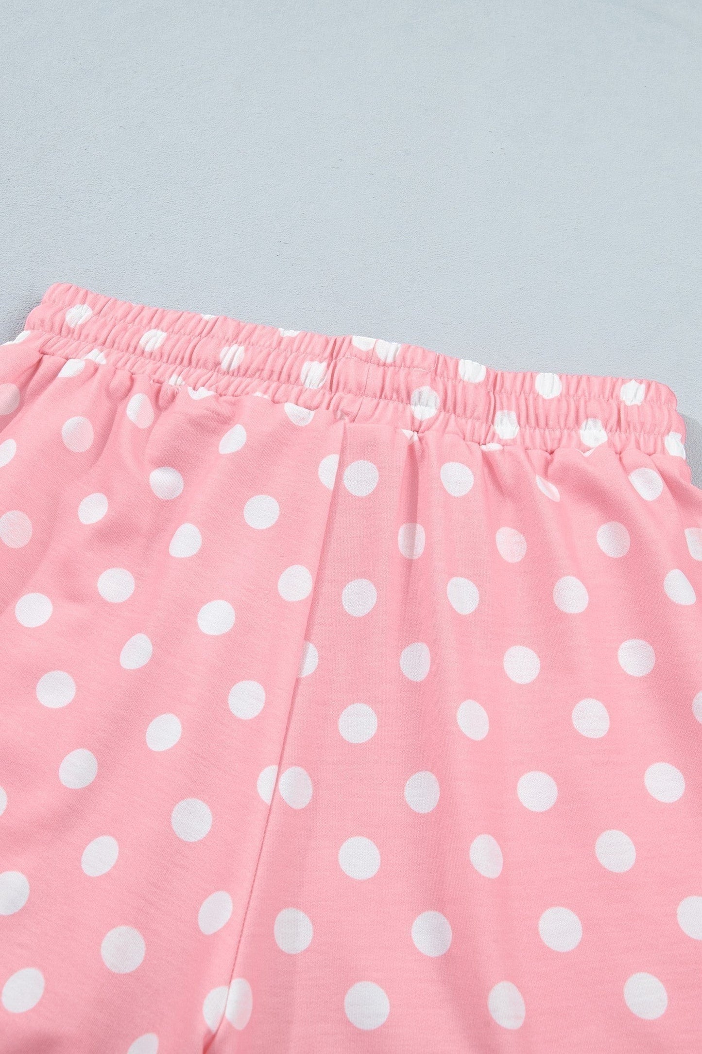 Doodlations Coffee Bar & Boutique pink lounge shorts with white polka dots and an elastic drawstring waistband