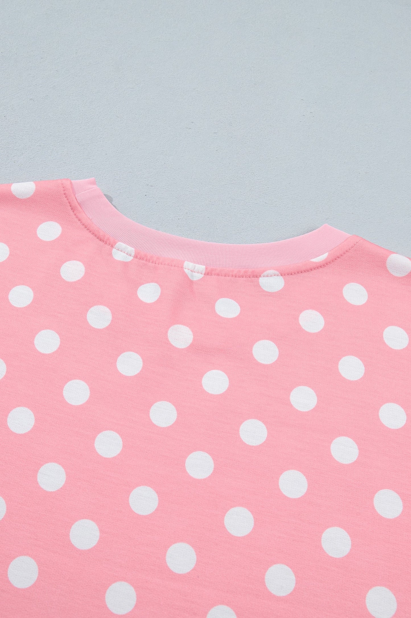 Doodlations Coffee Bar & Boutique pink lounge top with white polka dots and a comfortable crew neckline