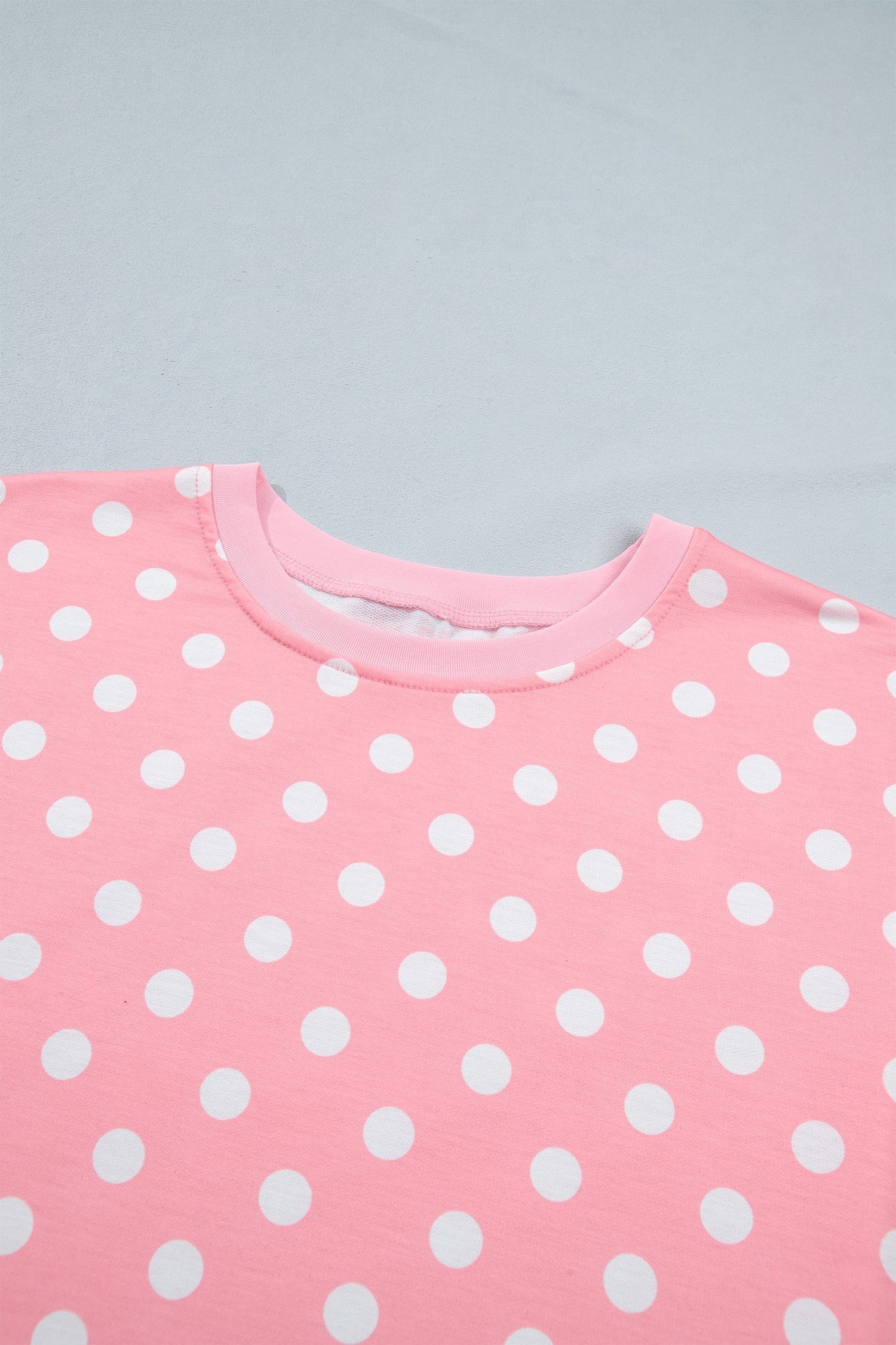 Doodlations Coffee Bar & Boutique pink lounge set top with white polka dots and a comfortable crew neckline