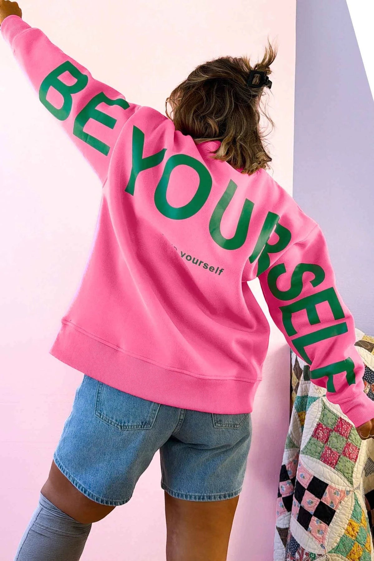Doodlations Coffee Bar & Boutique pink long sleeve sweatshirt with green Be Yourself slogan print on the back