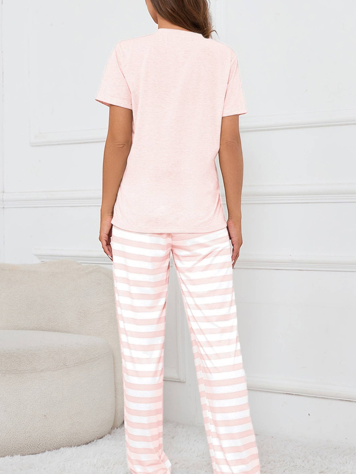 Doodlations Coffee Bar & Boutique pink and white striped pajama set with short sleeve top and wide-leg pants.
