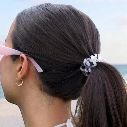 Doodlations Coffee Bar & Boutique Pinch Me! Teleties hair ties in a pink marble spiral design worn in a ponytail.