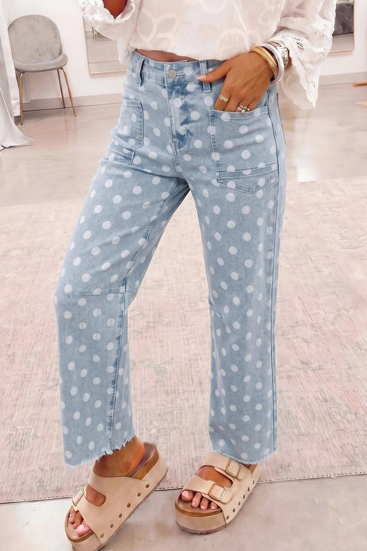 Doodlations Coffee Bar & Boutique sky blue denim jeans featuring a white polka dot pattern and raw hem detail.