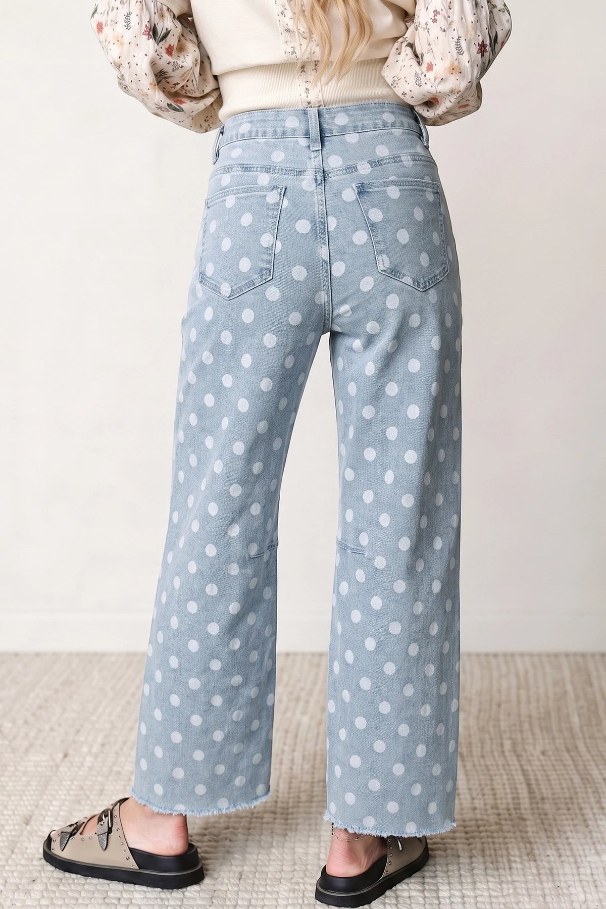 Doodlations Coffee Bar & Boutique sky blue denim jeans with white polka dots and a raw hem, back view