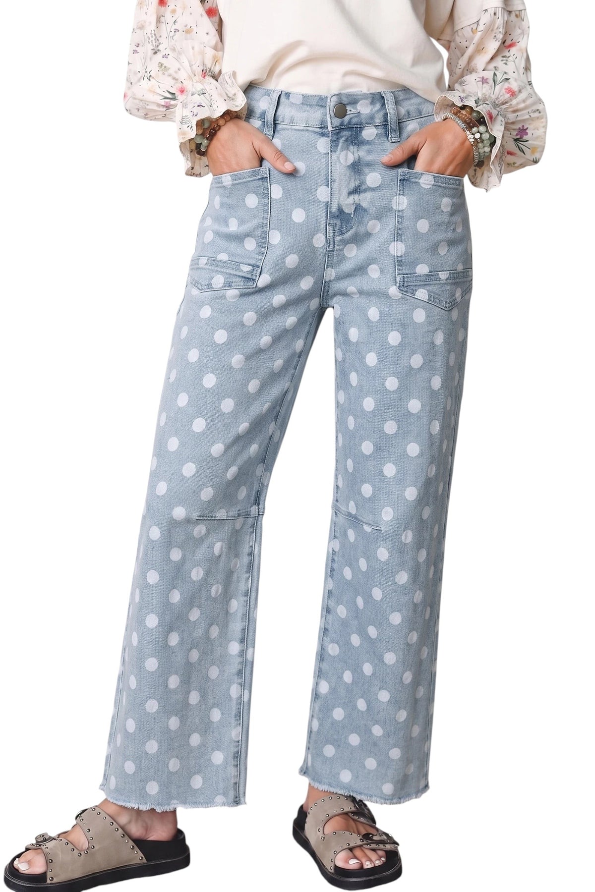Doodlations Coffee Bar & Boutique sky blue denim jeans with white polka dots, slim fit, and raw hem detail.