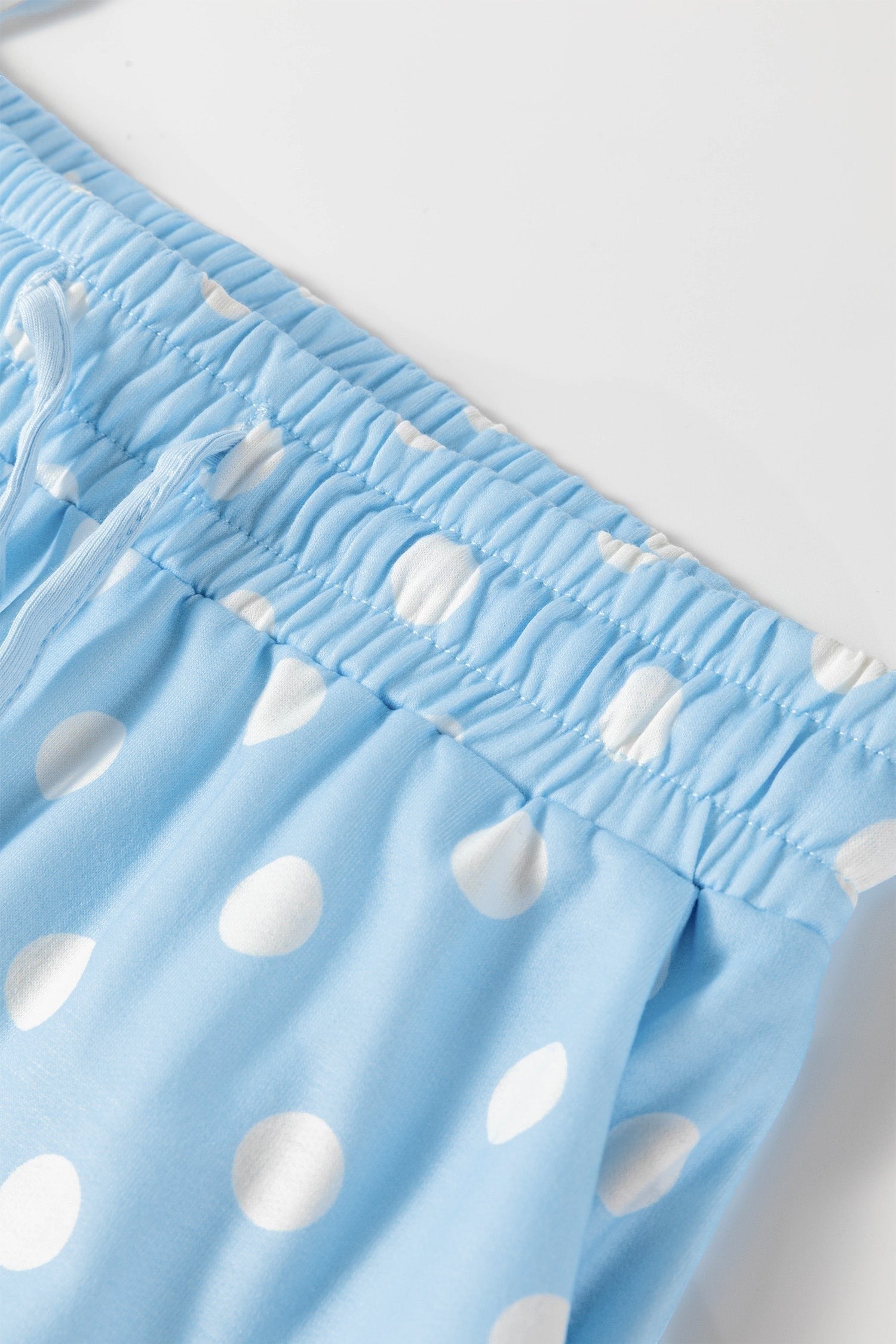 Doodlations Coffee Bar & Boutique light blue lounge shorts with white polka dots, elastic waistband and drawstring.