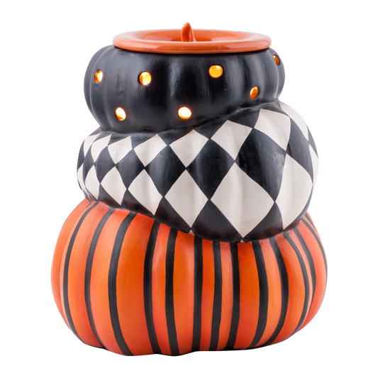 Doodlations Coffee Bar & Boutique ceramic stacked pumpkin wax warmer with black, orange, and harlequin patterns.