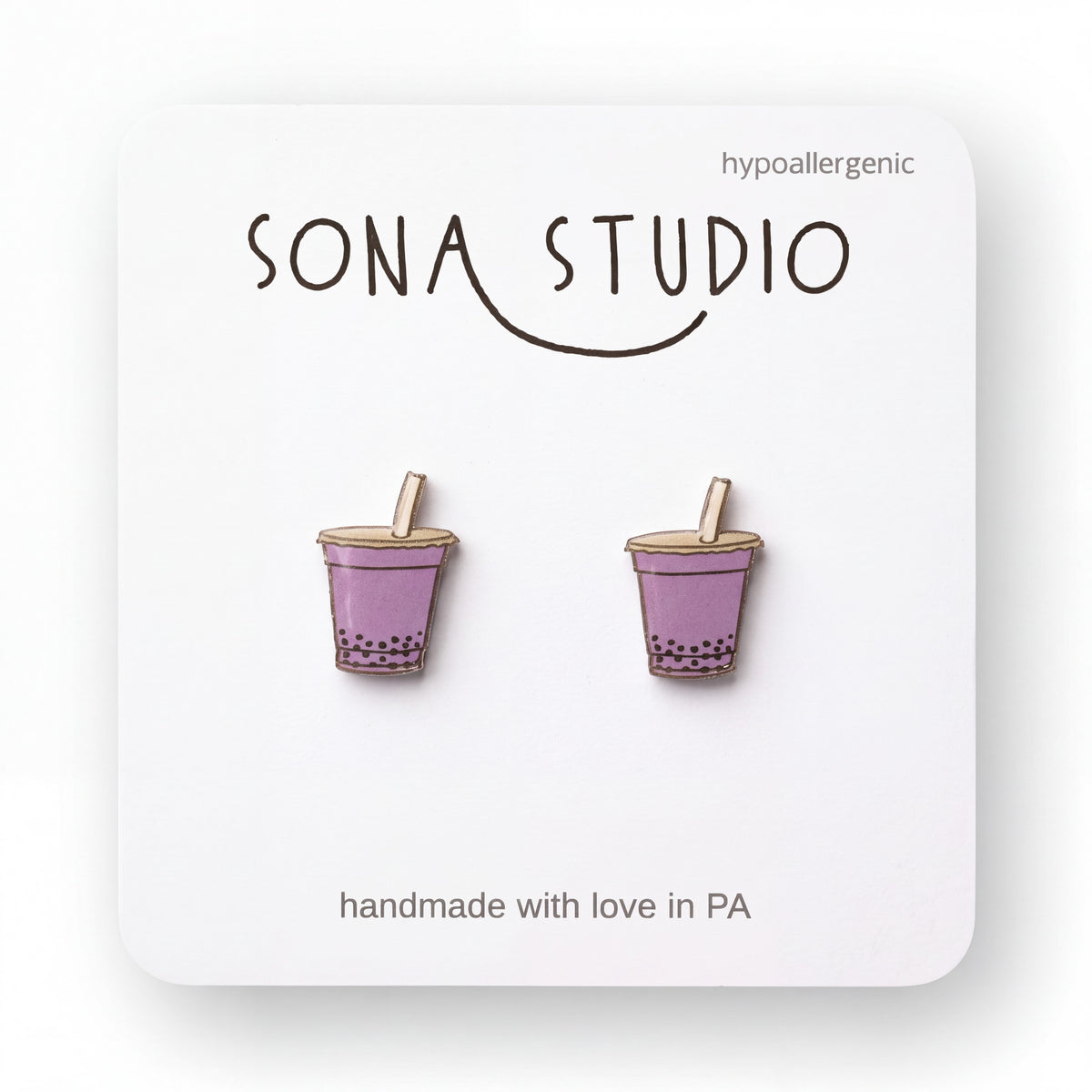 Doodlations Coffee Bar & Boutique handmade purple bubble tea stud earrings with titanium posts on display card