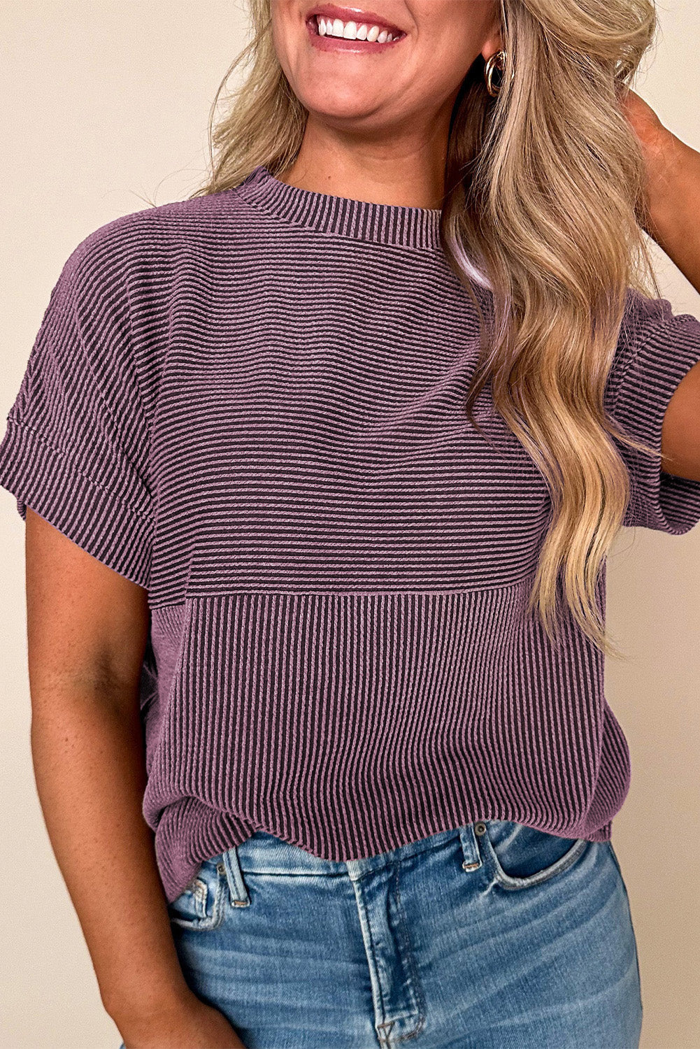 Doodlations Coffee Bar & Boutique purple corded mock neck short sleeve knit top worn with blue jeans