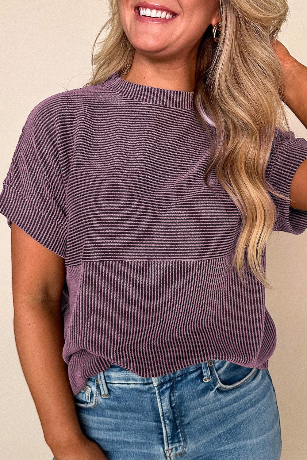 Doodlations Coffee Bar & Boutique purple corded mock neck short sleeve knit top worn with blue jeans