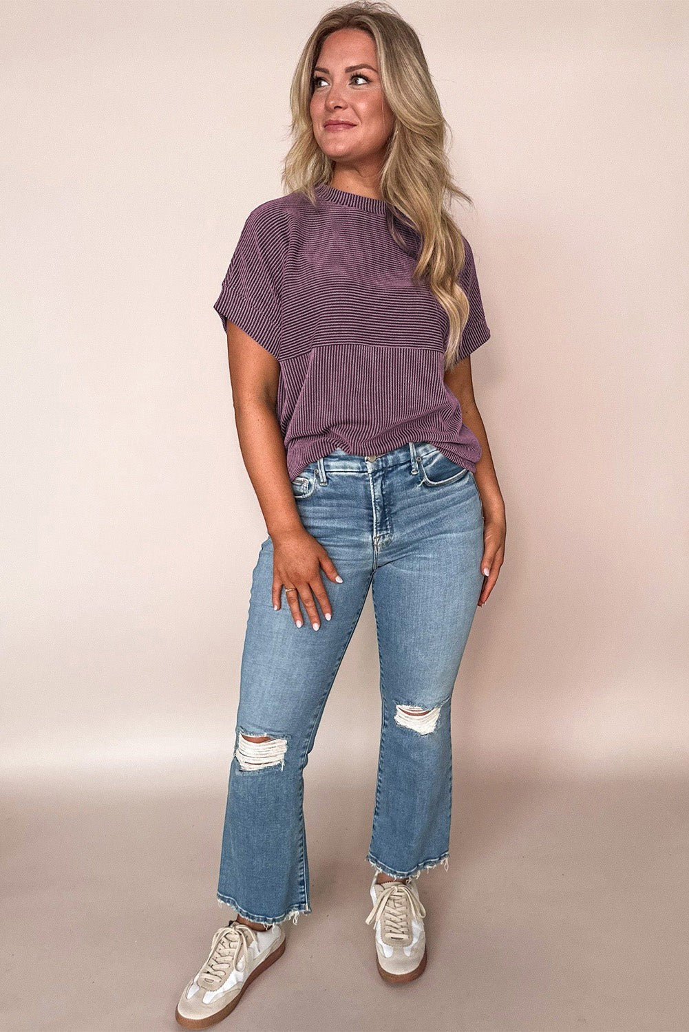 Doodlations Coffee Bar & Boutique purple corded mock neck short sleeve knit top worn with distressed blue jeans