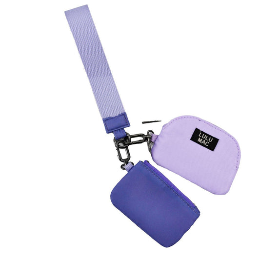 Doodlations Coffee Bar & Boutique Lulu Mac double pouch wristlet in purple and lavender with a matching wrist strap.