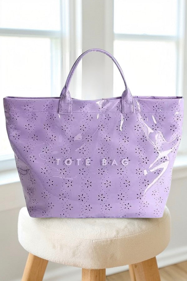 Doodlations Coffee Bar & Boutique purple tote bag with glossy eyelet floral pattern and sturdy handles.