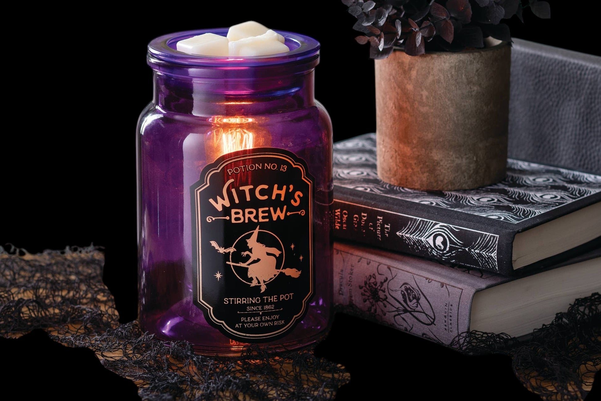 Doodlations Coffee Bar & Boutique purple glass Witch's Brew fragrance warmer with vintage apothecary label