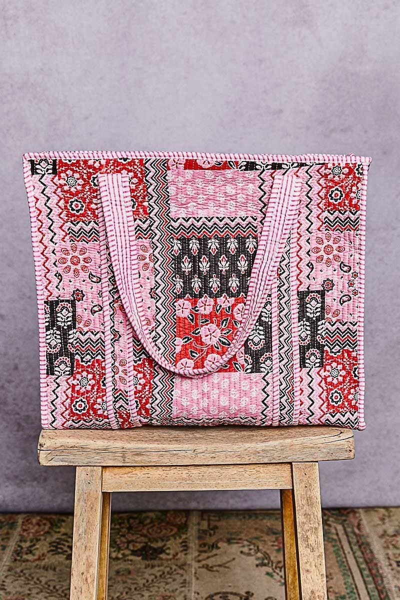 Doodlations Coffee Bar & Boutique quilted woven tote bag featuring a pink and black bohemian patchwork print
