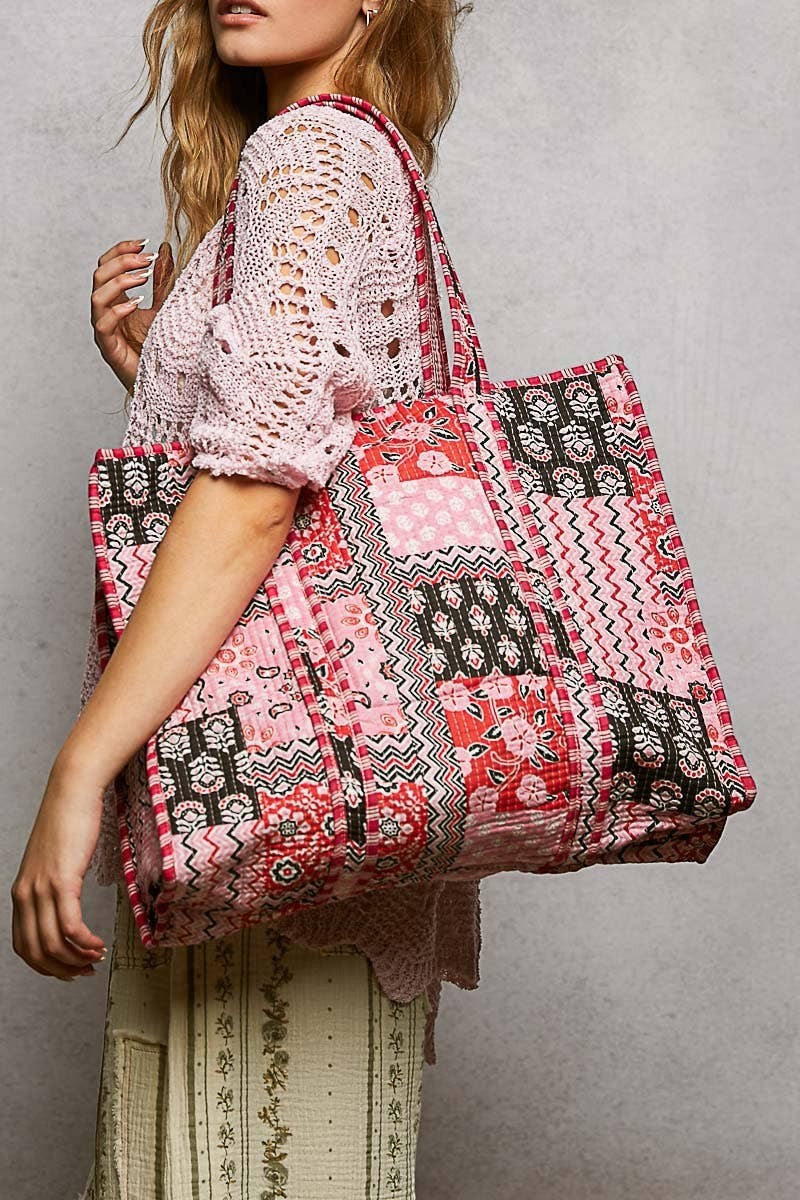 Doodlations Coffee Bar & Boutique quilted woven tote bag featuring a bohemian patchwork print and striped handle detail.