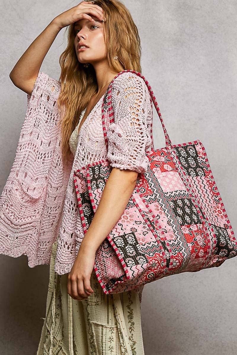 Doodlations Coffee Bar & Boutique quilted woven tote bag with bohemian pink and black prints and striped handle