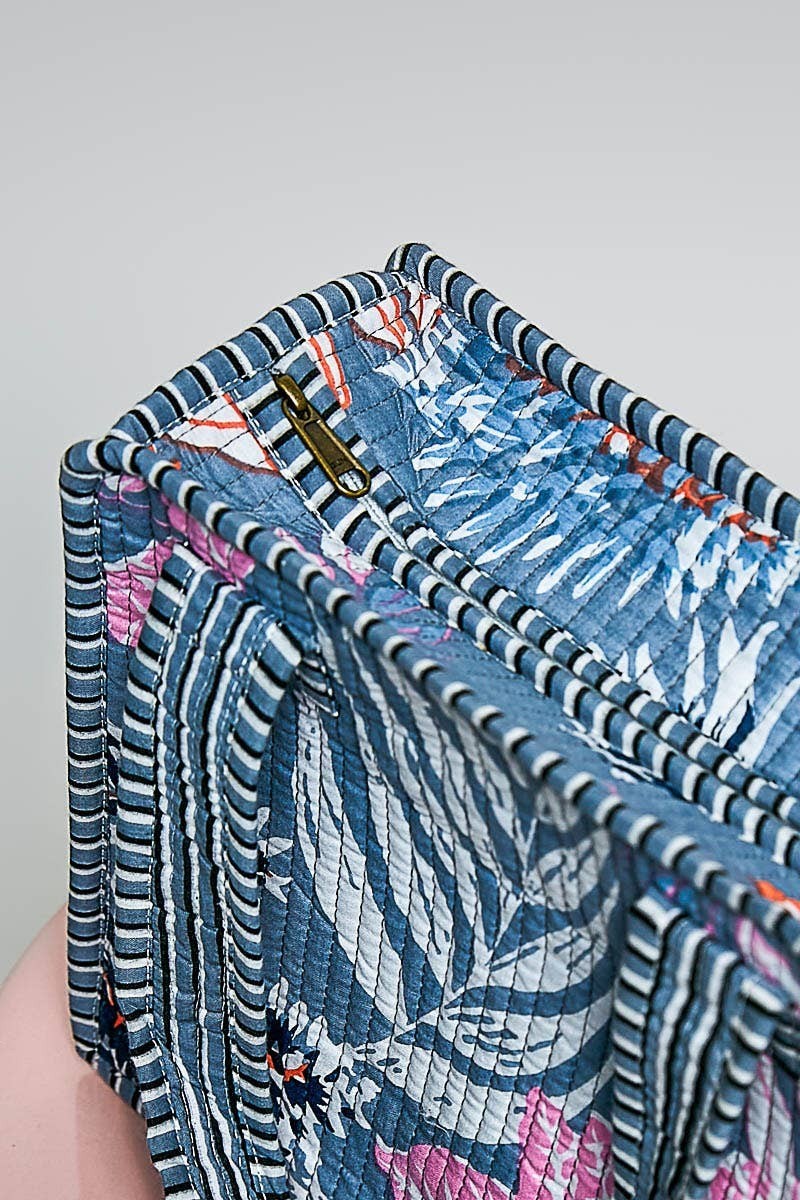 Doodlations Coffee Bar & Boutique mini quilted cotton cube bag with blue floral print and brass zipper detail
