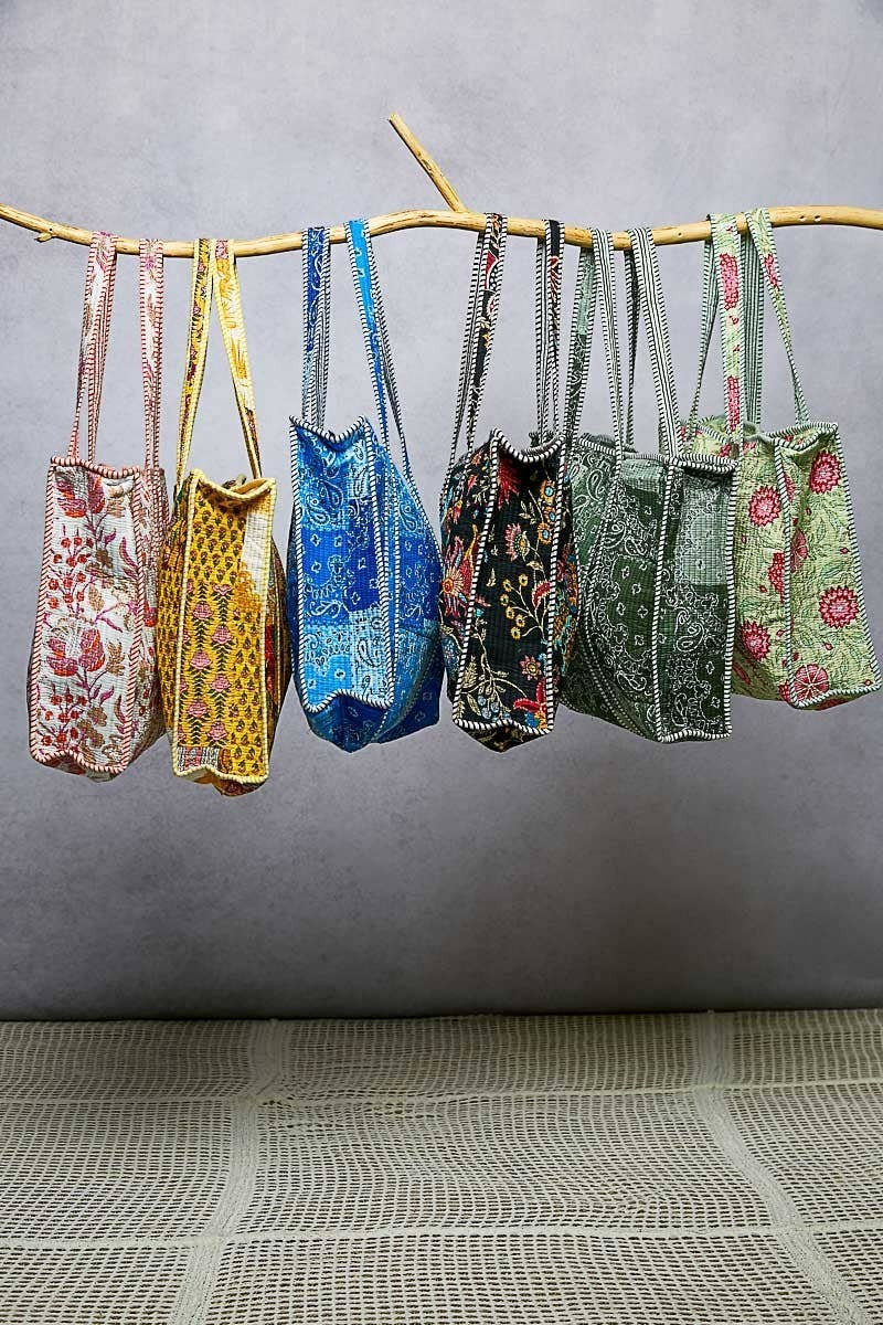 Doodlations Coffee Bar & Boutique collection of quilted woven tote bags with floral prints and striped binding accents