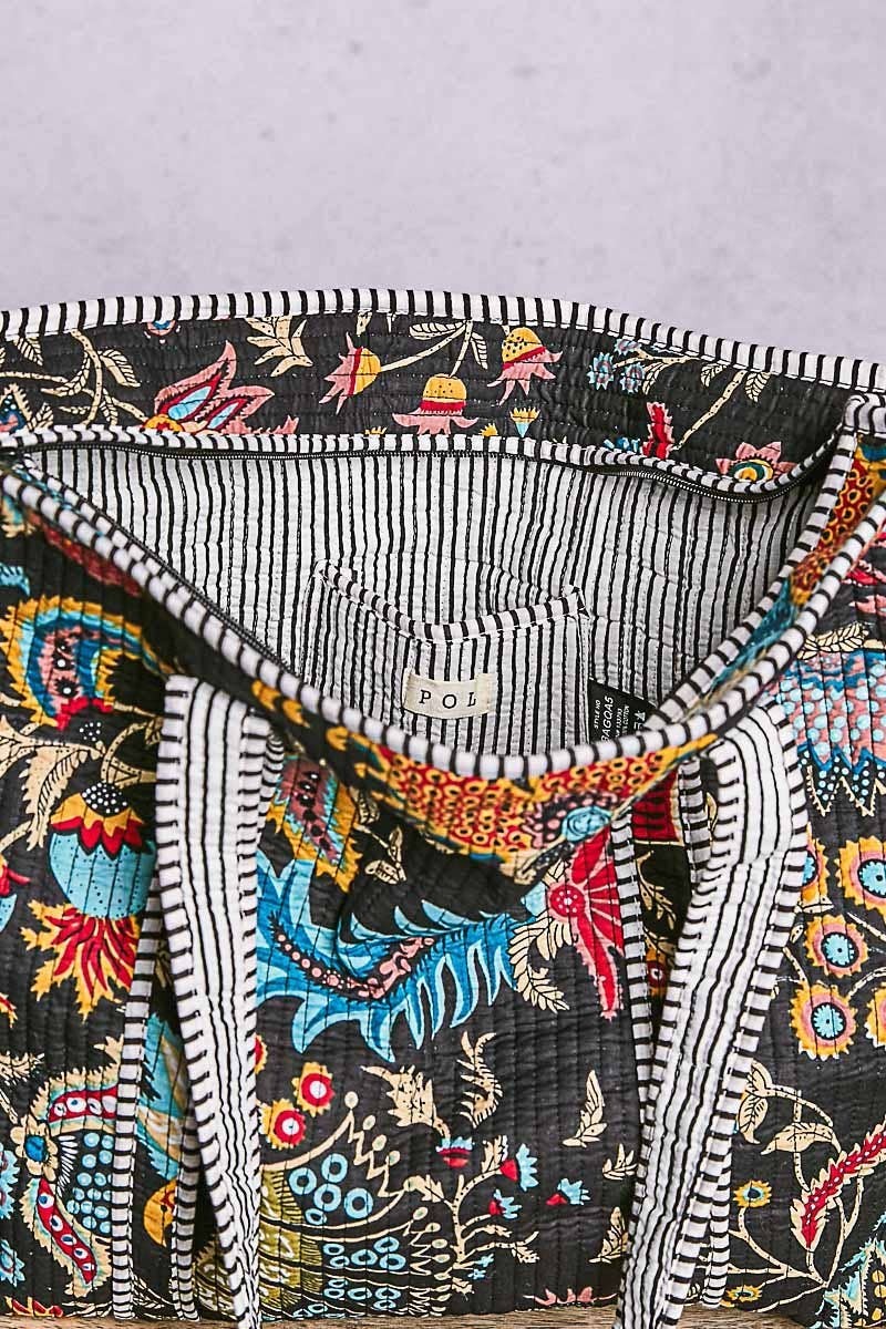 Doodlations Coffee Bar & Boutique black quilted tote bag with floral print and striped binding interior details
