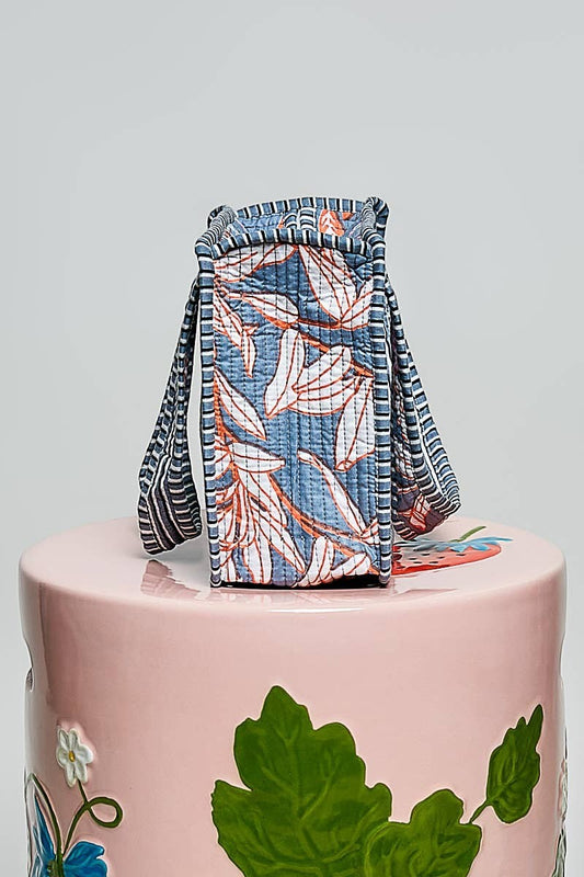 Doodlations Coffee Bar & Boutique mini quilted cotton tote bag with blue and orange leaf print, side view
