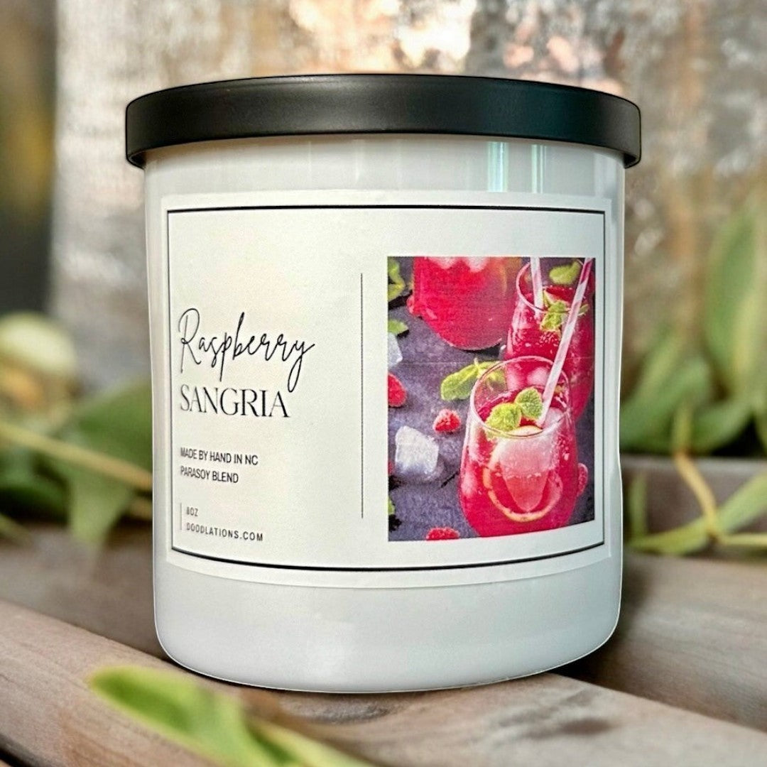 Doodlations Coffee Bar & Boutique Raspberry Sangria luxury soy blend candle with a fruity scent.