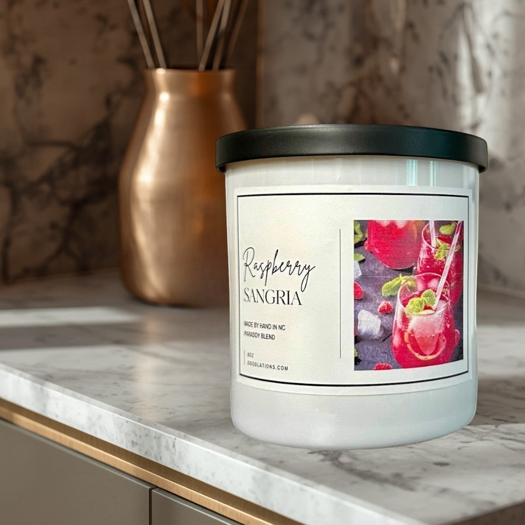 Doodlations Coffee Bar & Boutique Raspberry Sangria luxury soy blend candle with a fruity sangria scent.