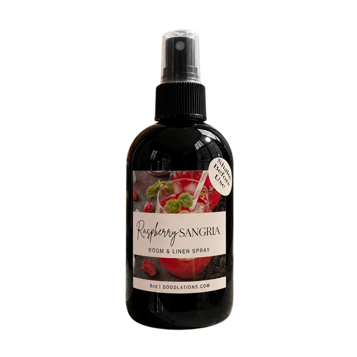 Doodlations Coffee Bar & Boutique Raspberry Sangria room and linen spray in a black bottle with a fruit-themed label.