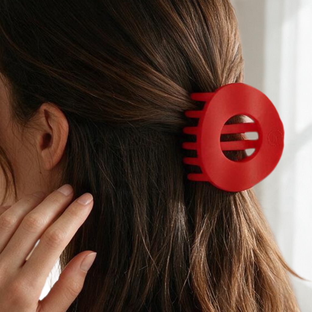Doodlations Coffee Bar & Boutique red Teleties flat circle hair clip worn in brown hair for a secure, comfortable hold