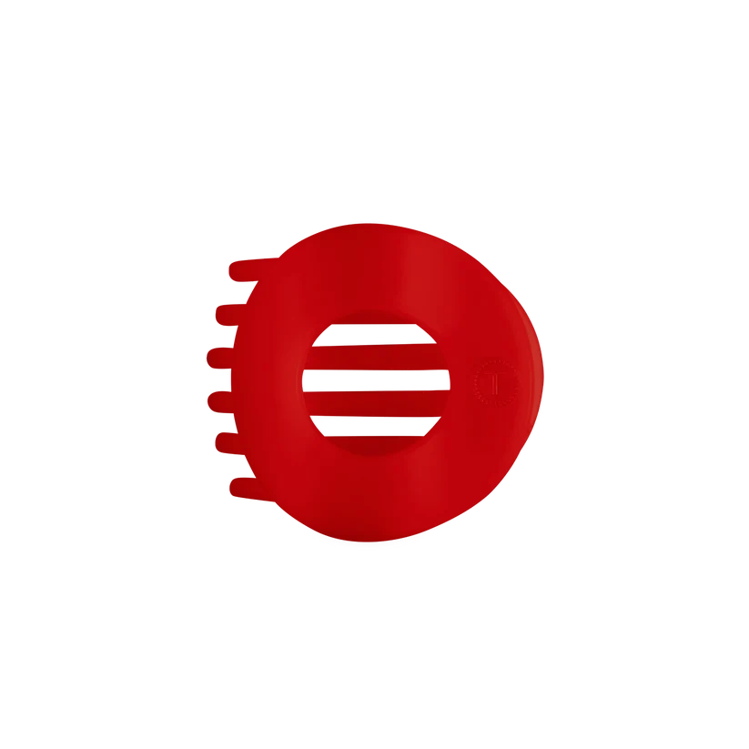 Doodlations Coffee Bar & Boutique red circular flat hair clip with bendable teeth for a comfortable, secure hold.
